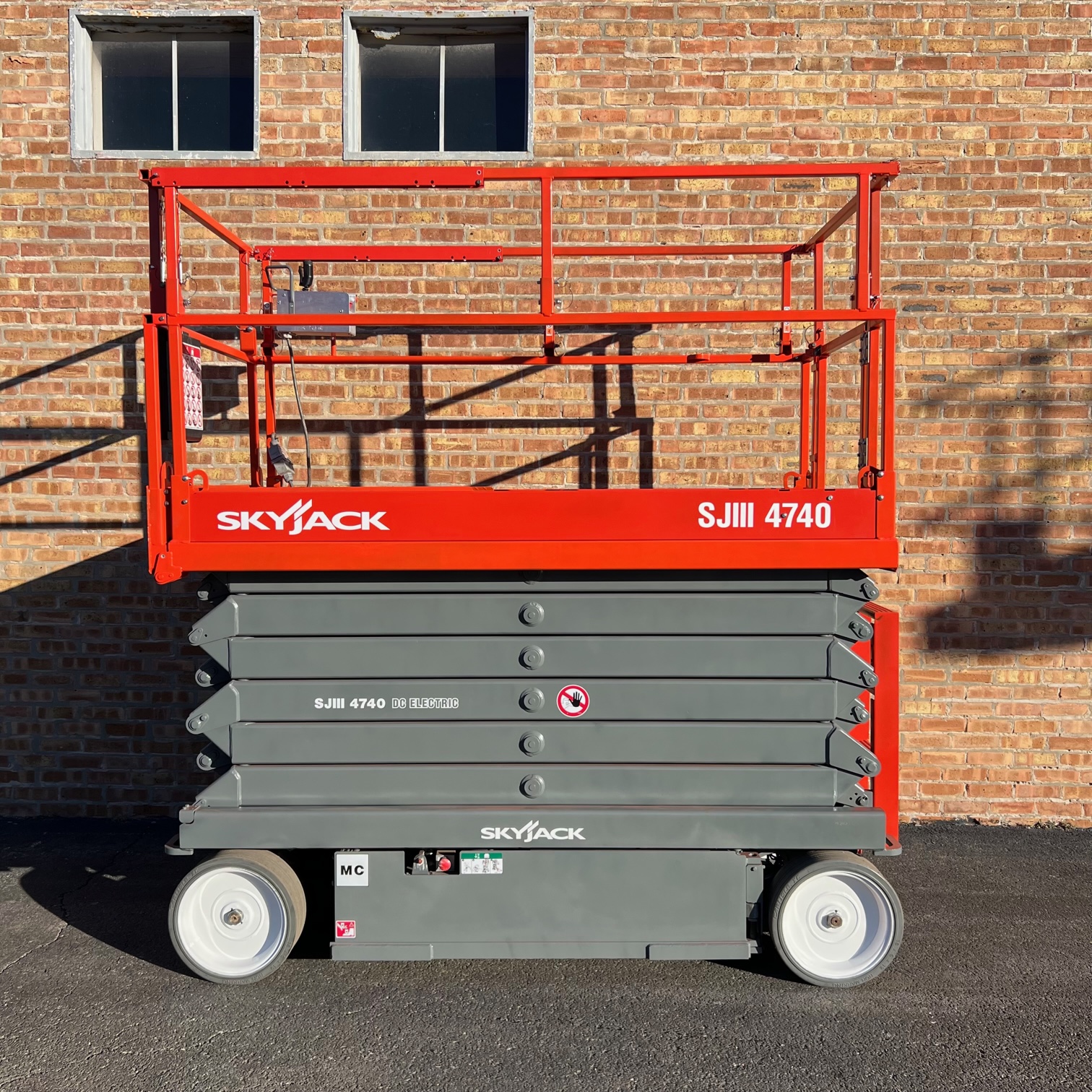 Refurbished 40 ft Skyjack and Genie scissor lifts for sale — Win Win Equipment Addison IL